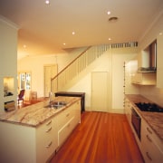 A view of a cottage renovated by Cape cabinetry, ceiling, countertop, floor, flooring, hardwood, home, house, interior design, kitchen, lighting, real estate, room, wood, wood flooring, orange
