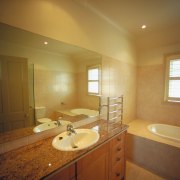 A view of a cottage renovated by Cape architecture, bathroom, ceiling, countertop, daylighting, floor, home, house, interior design, light fixture, lighting, property, real estate, room, sink, wall, wood, brown