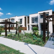 Row of home frontages with white weatherboard cladding apartment, architecture, condominium, elevation, estate, facade, home, house, mixed use, neighbourhood, property, real estate, residential area, white, teal