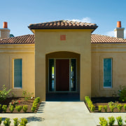 Front entranceway of country masonry villa with clay cottage, elevation, estate, facade, hacienda, historic house, home, house, landscaping, mansion, official residence, outdoor structure, property, real estate, residential area, roof, villa, window, brown, teal