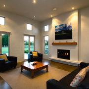 Family living room with cream walls, black lounge ceiling, hearth, interior design, living room, property, real estate, room, brown