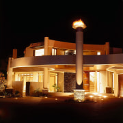 Exterior night view of large home with large architecture, home, light fixture, lighting, night, black