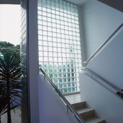 Stairway with white walls and glass brick exterior architecture, condominium, daylighting, glass, house, interior design, shade, window, window covering, window treatment, gray