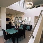 View of dining room with double height ceiling, ceiling, dining room, interior design, living room, property, real estate, room, gray, black