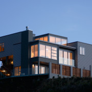 Exterior view of large multi-level home with weatherboard architecture, building, elevation, facade, home, house, property, real estate, residential area, siding, sky, teal, black