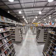 An interior view of the store. - An building, institution, inventory, library, liquor store, public library, retail, gray, black