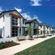 Row of new two-storey homes in residential development, cottage, elevation, estate, facade, home, house, mansion, neighbourhood, property, real estate, residential area, siding, sky, suburb, villa, window, blue