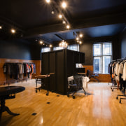 A view of a store, wooden flooring. - flooring, interior design, studio, black