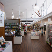 A view of the retail area. - A bookselling, exhibition, institution, interior design, library, public library, retail, gray