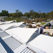 A view of the shade sails over a architecture, daylighting, outdoor structure, roof, tree, vacation, white