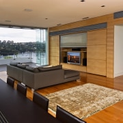 Family room with dark dining table, grey sofas floor, flooring, hardwood, interior design, living room, real estate, wood, wood flooring, brown