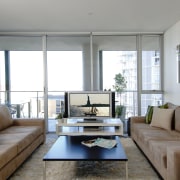 Lounge room with caramel coloured sofas, coffee table home, house, interior design, living room, property, real estate, room, window, gray, white