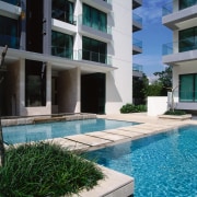 An exterior view of the swimming pool. - apartment, architecture, building, condominium, estate, facade, house, property, real estate, residential area, resort, swimming pool, black