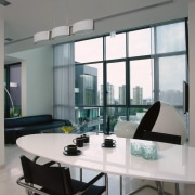 Aview of the dining area, tiled flooring, white furniture, glass, interior design, living room, table, window, gray