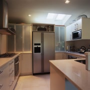 A view of the kitchen area, tiled floor, cabinetry, countertop, cuisine classique, interior design, kitchen, real estate, room, brown