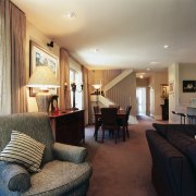 A view of the living and dining areas, ceiling, floor, flooring, home, interior design, living room, property, real estate, room, suite, orange, black