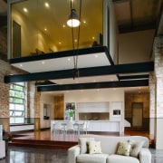 A view of the kitchen dining and living ceiling, home, interior design, lighting, living room, loft, brown, gray