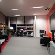 A view of the Mitsubishi Motors building. - interior design, office, gray, black