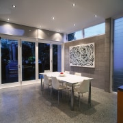 view of the dining area featuring polished concrete ceiling, interior design, lobby, real estate, table, wall, gray