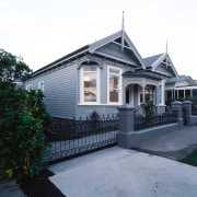 Exterior view of this double bay villa - architecture, building, cottage, estate, facade, home, house, property, real estate, residential area, roof, siding, window, gray, white