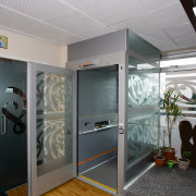 Disability lift featuring etched glass door and sides. ceiling, glass, interior design, gray