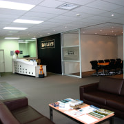 View of Bayleys office reception with black sofas, interior design, office, gray, black