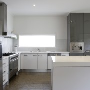 Kitchen with cream cabinetry and stainless steel appliances. countertop, home appliance, kitchen, real estate, room, gray