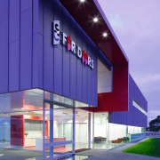 A view of the CS For Doors showroom. architecture, building, commercial building, corporate headquarters, elevation, facade, home, house, real estate, residential area, sky, blue, purple