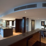 view of the kitchen featuring darkwood veneer wall, apartment, ceiling, estate, floor, interior design, real estate, gray