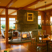 view of the sculptural fireplace featuring glass box, ceiling, fireplace, hardwood, hearth, home, interior design, lighting, living room, lobby, real estate, room, wall, window, wood, wood flooring, brown