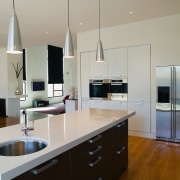 A view of the kitchen, wooden flooring and cabinetry, countertop, interior design, kitchen, real estate, room, gray