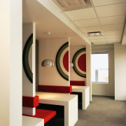 Mini breakout areas in office with graphic bulls-eye ceiling, interior design, lobby, white, orange