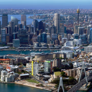 View of Jacksons Landing development in Sydney with aerial photography, bird's eye view, building, city, cityscape, daytime, downtown, metropolis, metropolitan area, sky, skyline, skyscraper, suburb, tower block, urban area, water, blue