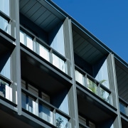 Exterior view of apartment building showing metal titanium apartment, architecture, building, commercial building, condominium, corporate headquarters, daylighting, daytime, facade, glass, headquarters, house, line, metropolitan area, mixed use, residential area, sky, window, black