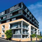 Exterior view of apartment building on corner site, apartment, architecture, building, commercial building, condominium, corporate headquarters, elevation, facade, home, house, metropolitan area, mixed use, neighbourhood, property, real estate, residential area