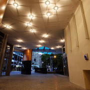 Lobby providing grand entrance to apartment building, and architecture, ceiling, daylighting, interior design, light, lighting, lobby, brown