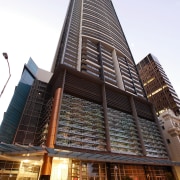 Exterior view of Aurora apartment building with artwork. architecture, building, city, commercial building, condominium, corporate headquarters, daytime, downtown, facade, hotel, landmark, metropolis, metropolitan area, mixed use, sky, skyscraper, tower, tower block, urban area, white