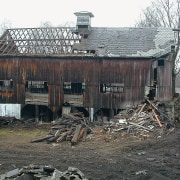 A view of some recliamed antique timber. - building, demolition, home, house, log cabin, roof, rural area, shack, shed, wood, black, gray, white