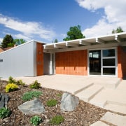 view of the exterior of this house featuring architecture, cottage, elevation, estate, facade, home, house, property, real estate, residential area, white