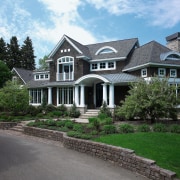 An exterior view of the entrance way and building, cottage, elevation, estate, facade, farmhouse, historic house, home, house, landscape, landscaping, lawn, mansion, neighbourhood, property, real estate, residential area, roof, siding, suburb, window, yard