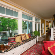 A view of the sun room, wooden flooring, ceiling, door, estate, home, interior design, living room, porch, real estate, window, window covering, brown, white
