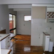 view of the kitchen awaiting renovation - view architecture, cabinetry, door, floor, flooring, hardwood, home, house, interior design, kitchen, loft, real estate, room, wood, gray