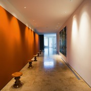 view of this gallery space featuring teracoota coloured architecture, ceiling, daylighting, floor, flooring, hall, interior design, real estate, wall, brown