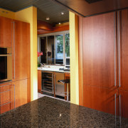 view of the new kitchen featuring cherry veneer cabinetry, ceiling, countertop, floor, flooring, hardwood, interior design, kitchen, real estate, room, wood, wood flooring, black, brown