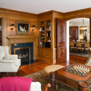 view of sthe library featuring mahogany flooring, chess estate, furniture, home, interior design, living room, real estate, room, brown