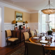 view of the dining area featuring mahogany flooring, dining room, home, interior design, living room, real estate, room, table, gray