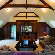 view of the billiard and entertainment room featuring beam, ceiling, daylighting, estate, home, house, interior design, living room, real estate, room, window, wood, black, orange