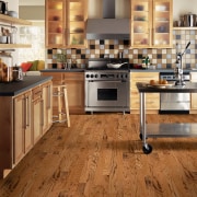 A view of some wooden flooring by Armstrong. cabinetry, countertop, cuisine classique, floor, flooring, hardwood, interior design, kitchen, laminate flooring, tile, wood, wood flooring, brown