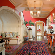 view of the hallway featuring bright red colours, ceiling, dining room, estate, flooring, hall, home, house, interior design, living room, lobby, real estate, room, wall