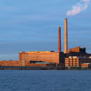 An exterior view of the entire complex. - building, city, cityscape, cloud, dawn, daytime, dusk, evening, horizon, metropolitan area, reflection, sea, sky, skyline, skyscraper, sunset, tower, tower block, water, waterway, teal